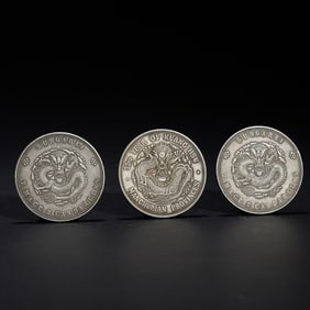 THREE SILVER DRAGON COINS
