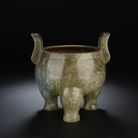 A CARVED JADE TRIPOD CENSER