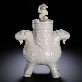 A TING-WARE MYTHICAL BEAST VESSEL WITH COVER