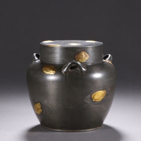 A GOLD SPLASHED TIN-WARE TEA CADDY WITH COVER