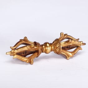 A BRONZE-GILT VAJRA