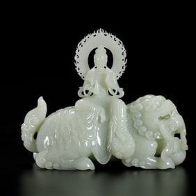 A FINE CARVED WHITE JADE GUANYIN