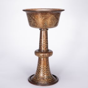 A BRONZE BUTTER LAMP