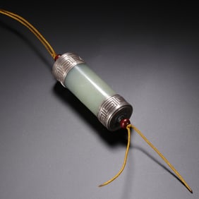 A CARVED JADE PENDANT