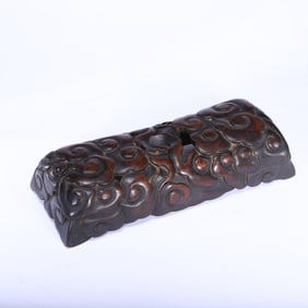 A CARVED ROSEWOOD ZITAN WRIST REST