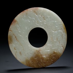 A CARVED JADE DRAGON AND PHOENIX DISC BI