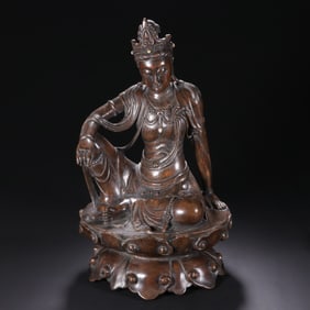 A CARVED ALOES WOOD CHENXIANG SEATED GUANYIN
