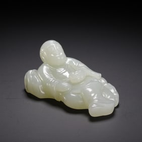 PALE JADE RECLINING DEITY CARVING