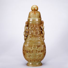 A CHINESE ARCHAISTIC YELLOW JADE VASE WITH COVER