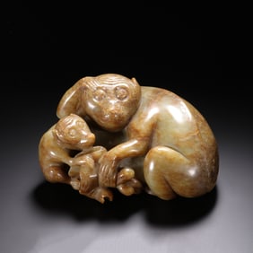 A CARVED JADE MONKEYS GROUP