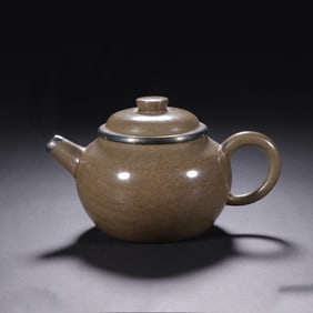 A YIXING GLAZE ZISHA TEAPOT