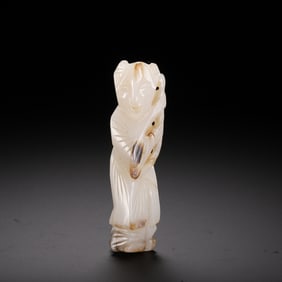A CARVED WHITE JADE BOY