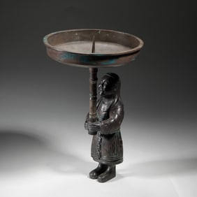 A BRONZE FIGURAL CANDLE-STICK
