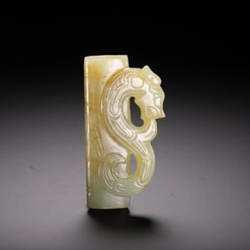 A CARVED JADE DRAGON PENDANT