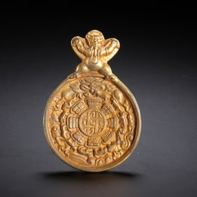 GILDED TIBETAN BUDDHIST AMULET PLAQUE