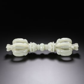 A CARVED WHITE JADE VAJRA