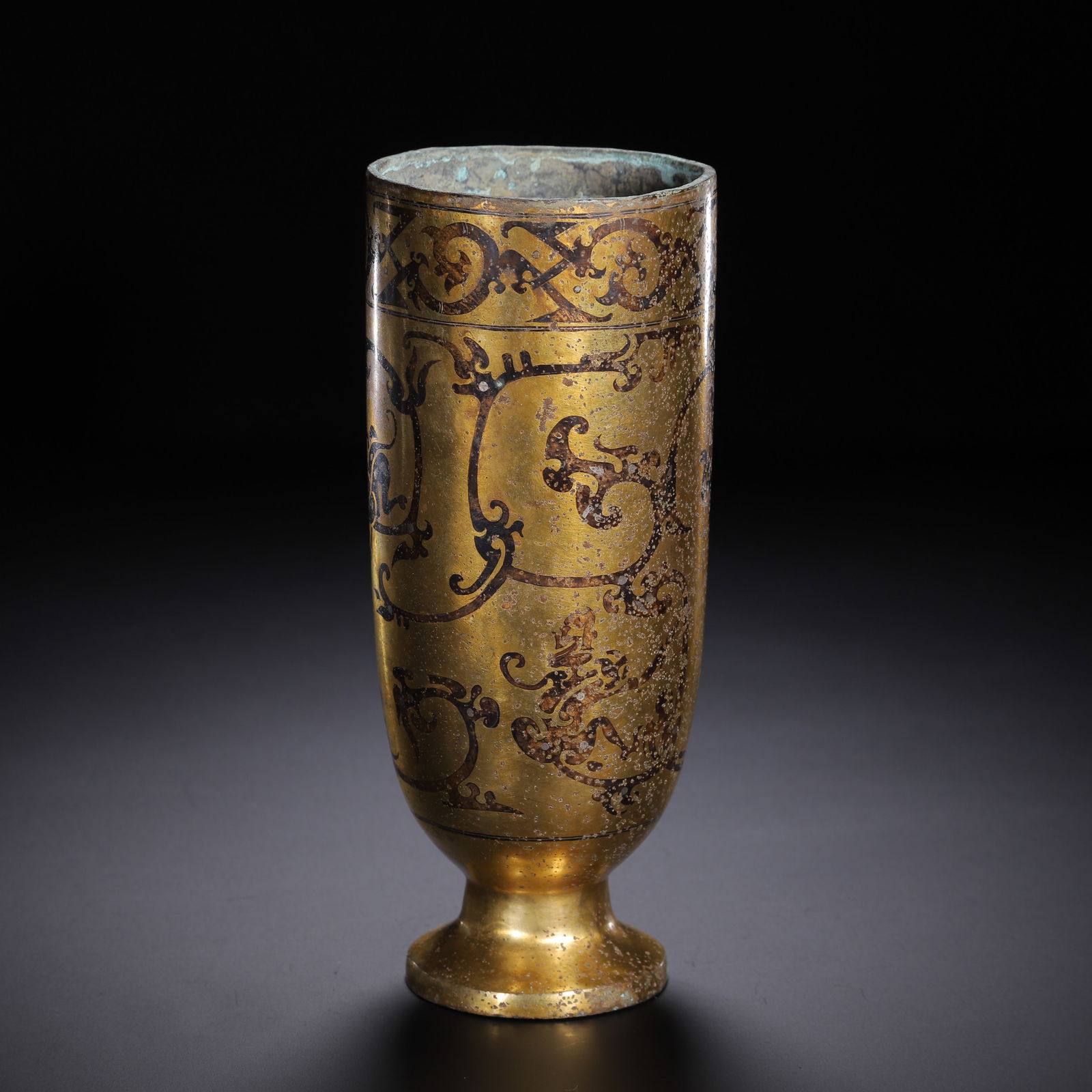 A BRONZE PARTLY GILT CUP (1 of 9)