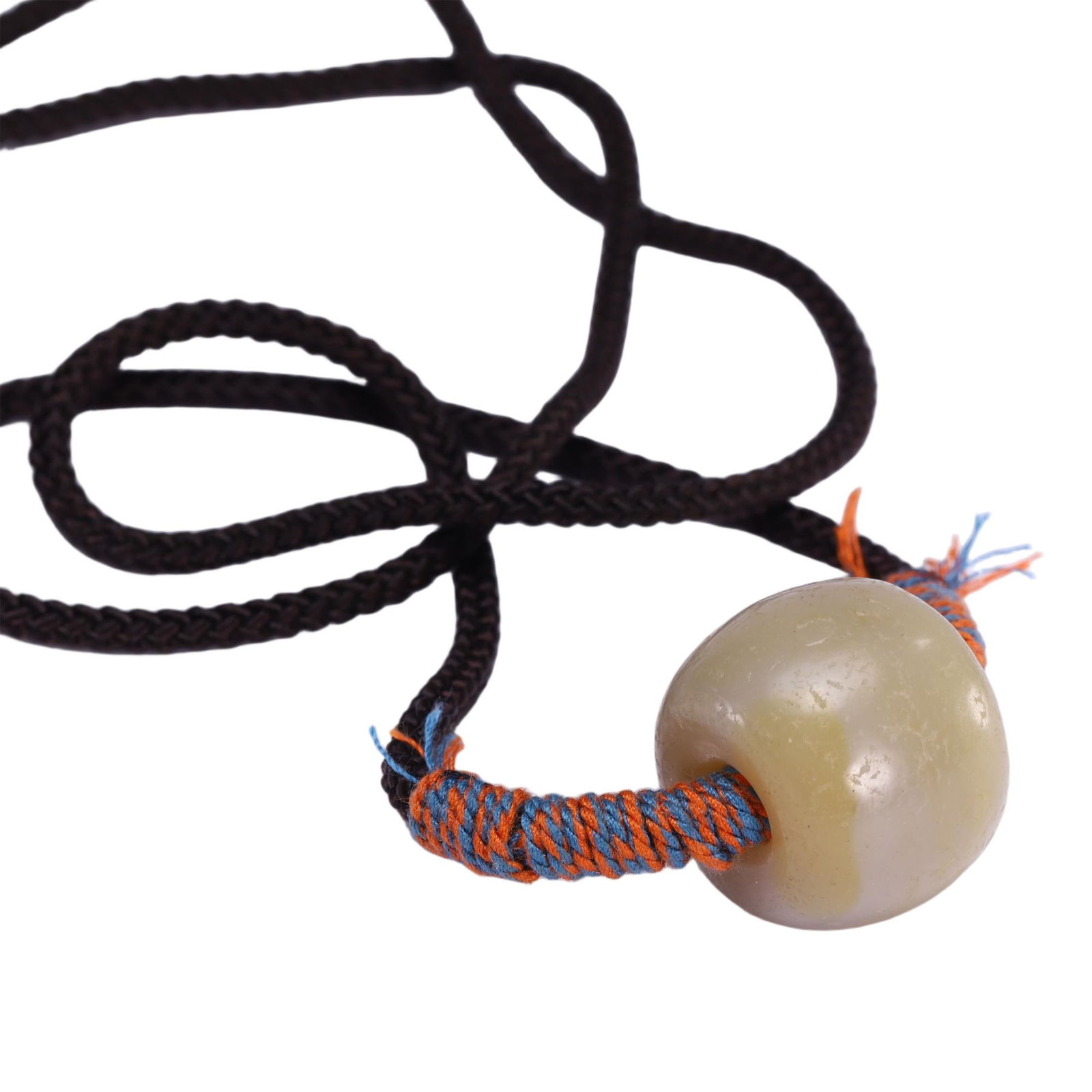 A TIBETAN DZI BEAD PENDANT: A TIBETAN DZI BEAD PENDANT This Chinese dzi bead pendant necklace features a large, spherical dzi bead of pale, milky white hue, suspended from a dark brown cord with vibrant orange and blue wrapped e