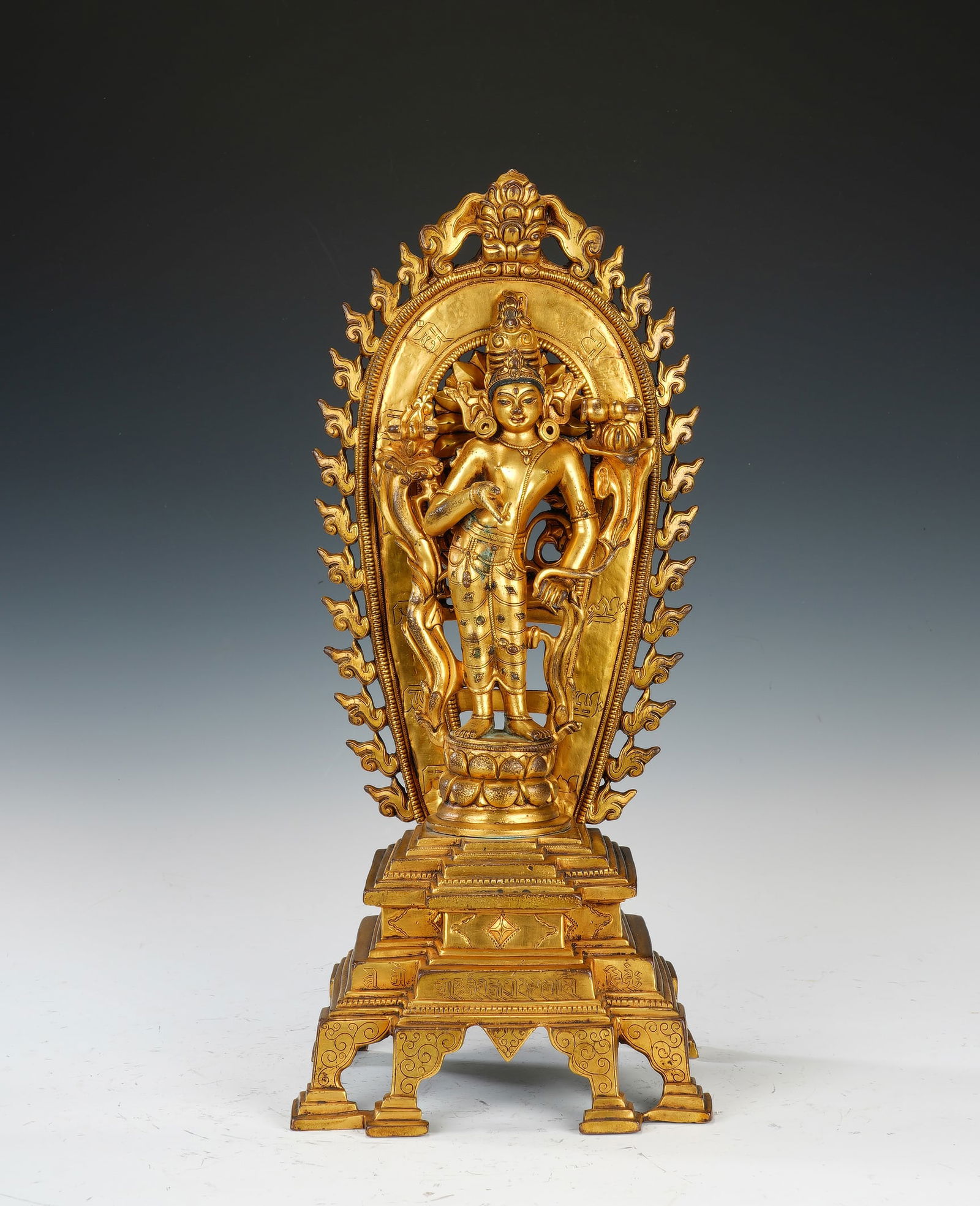 A BRONZE-GILT STANDING PADMAPANI (1 of 8)