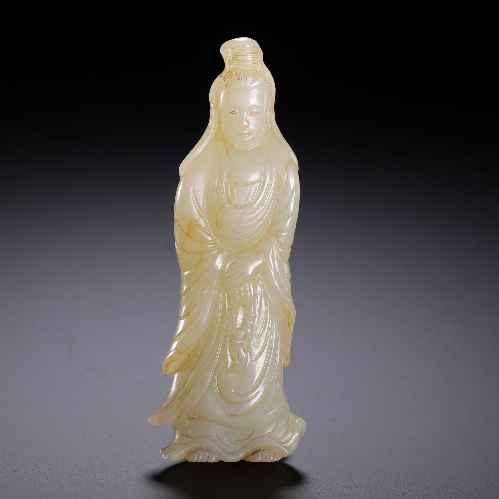 A CARVED WHITE JADE STANDING GUANYIN (1 of 9)