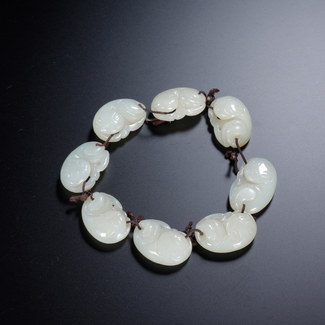 A WHITE JADE MYTHICAL BEASTS BRACELET (1 of 6)