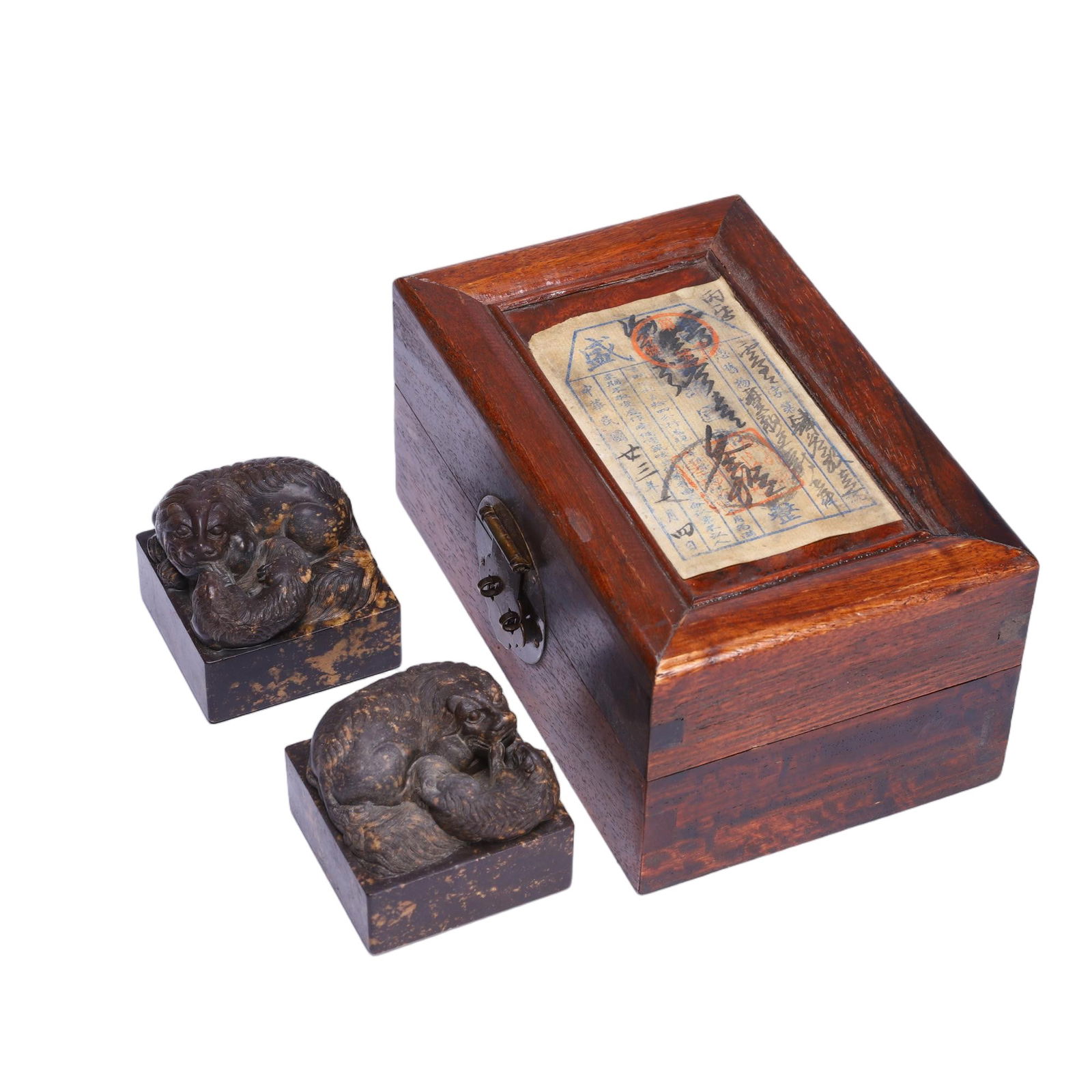 PAIR CARVED SHOUSHAN STONE SEALS WITH BOX: PAIR CARVED SHOUSHAN STONE SEALS WITH BOX This set of two Chinese Shoushan stone seals is masterfully carved from variegated Shoushan stone with a rich dark brown hue and natural golden inclusions.
