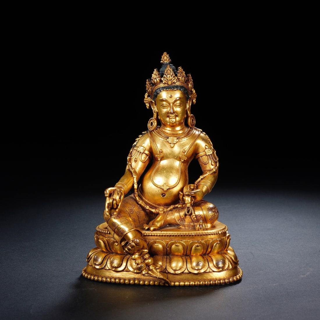 A BRONZE-GILT FIGURE OF JAMBHALA (1 of 7)