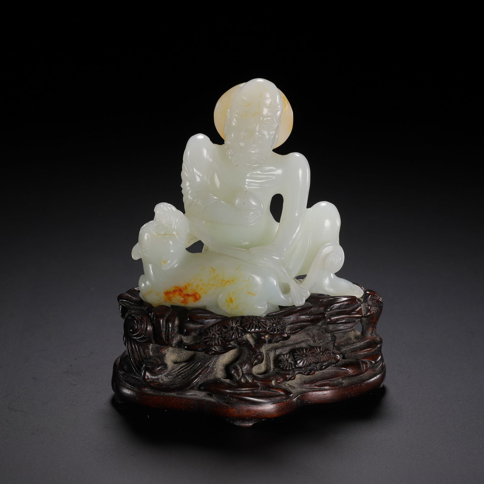 A CARVED WHITE JADE LUOHAN (1 of 9)