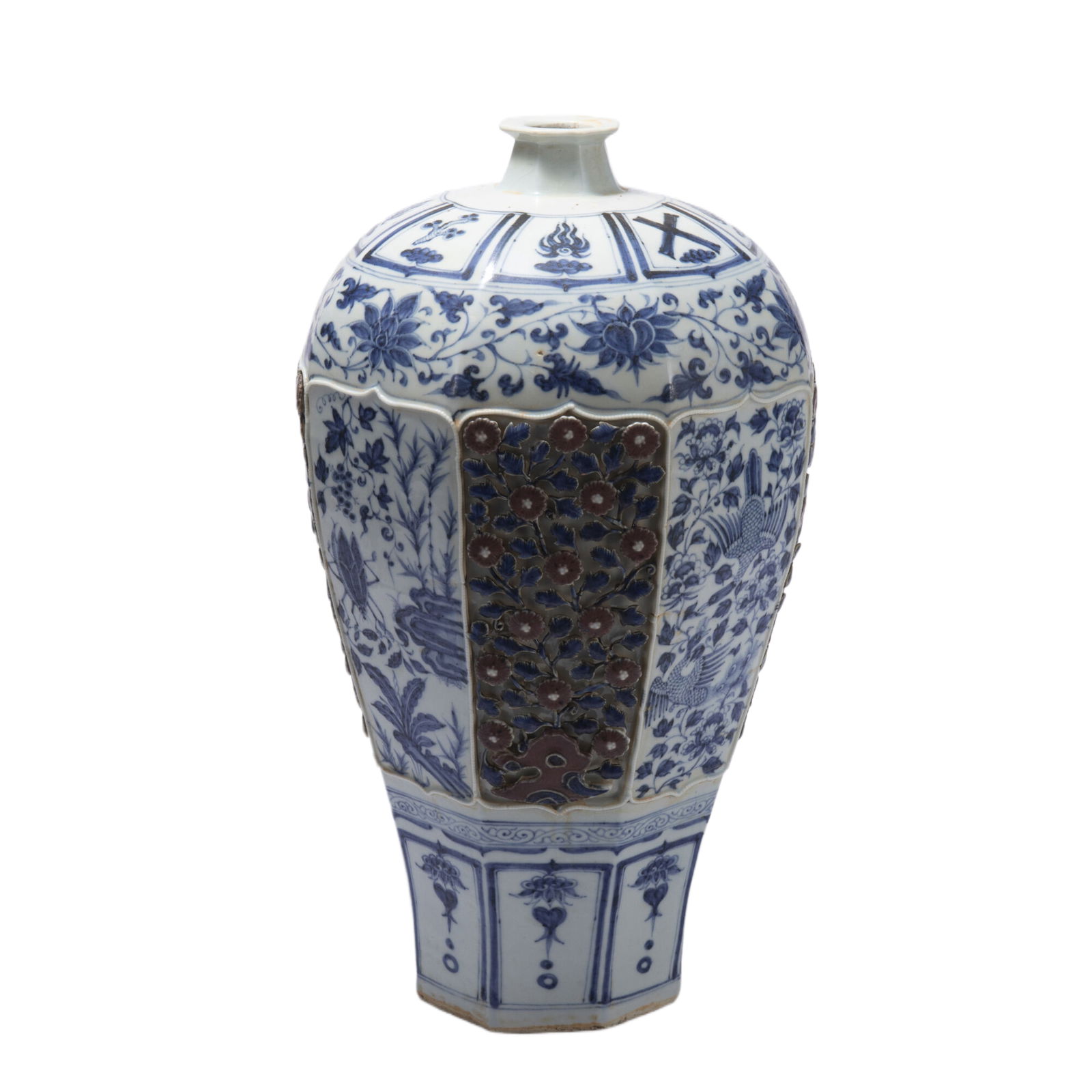 A CHINESE UNDERGLAZE BLUE AND COPPER RED VASE MEIPING: A CHINESE UNDERGLAZE BLUE AND COPPER RED VASE MEIPING This Chinese blue and white carved porcelain meiping vase is a striking octagonal form with a narrow neck and broad shoulders, covered in a bright