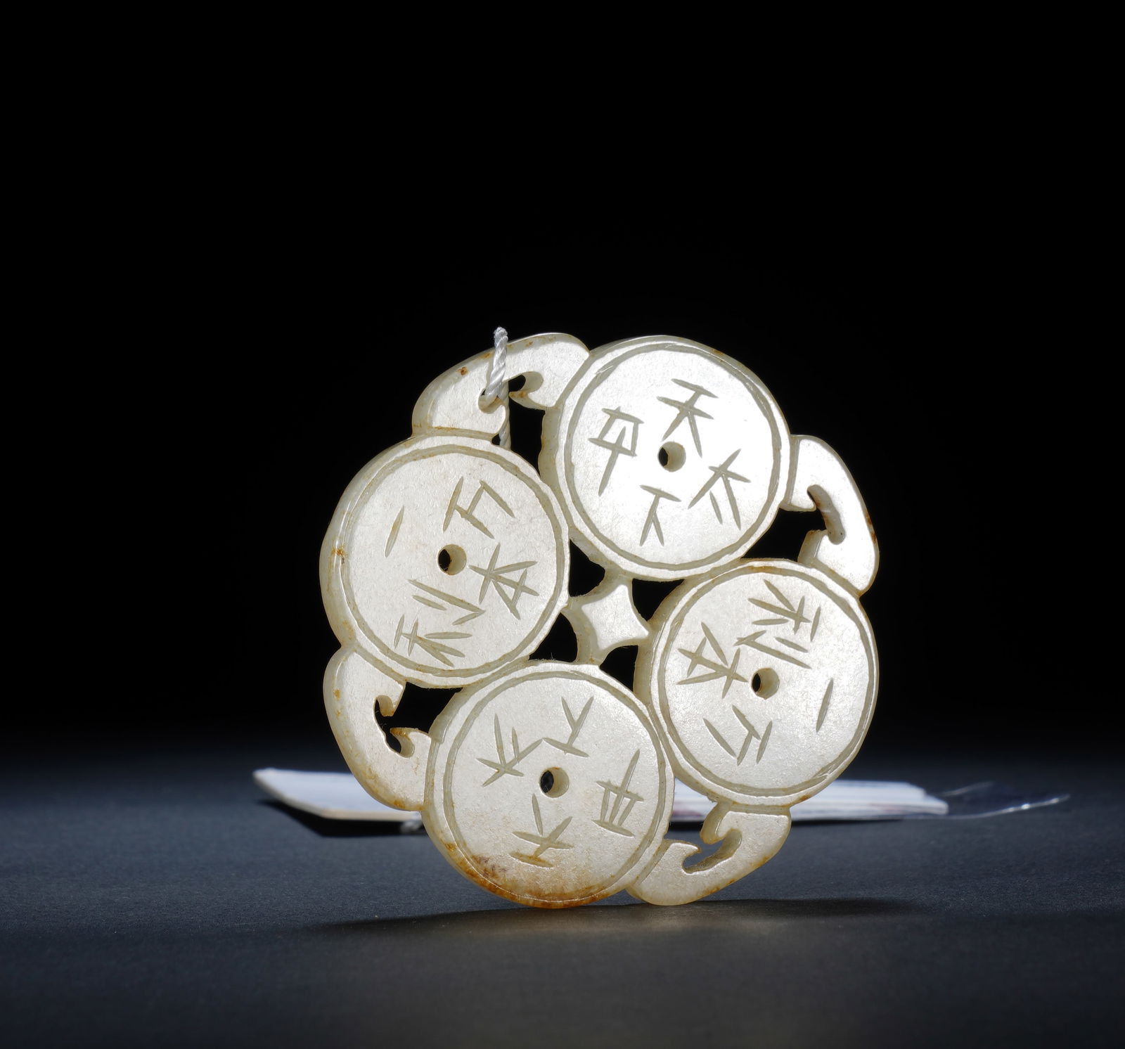 A CARVED JADE ORNAMENT (1 of 8)