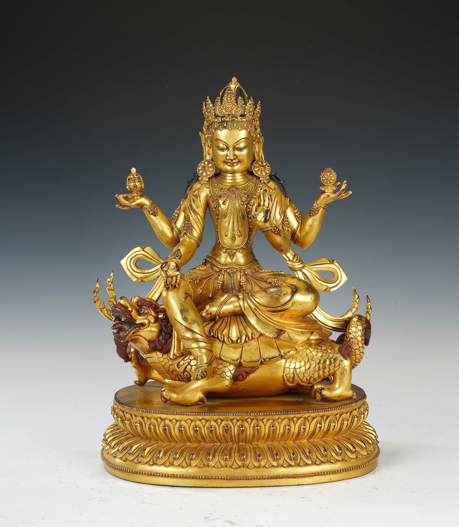 A BRONZE-GILT SEATED BODHISATTVA (1 of 9)