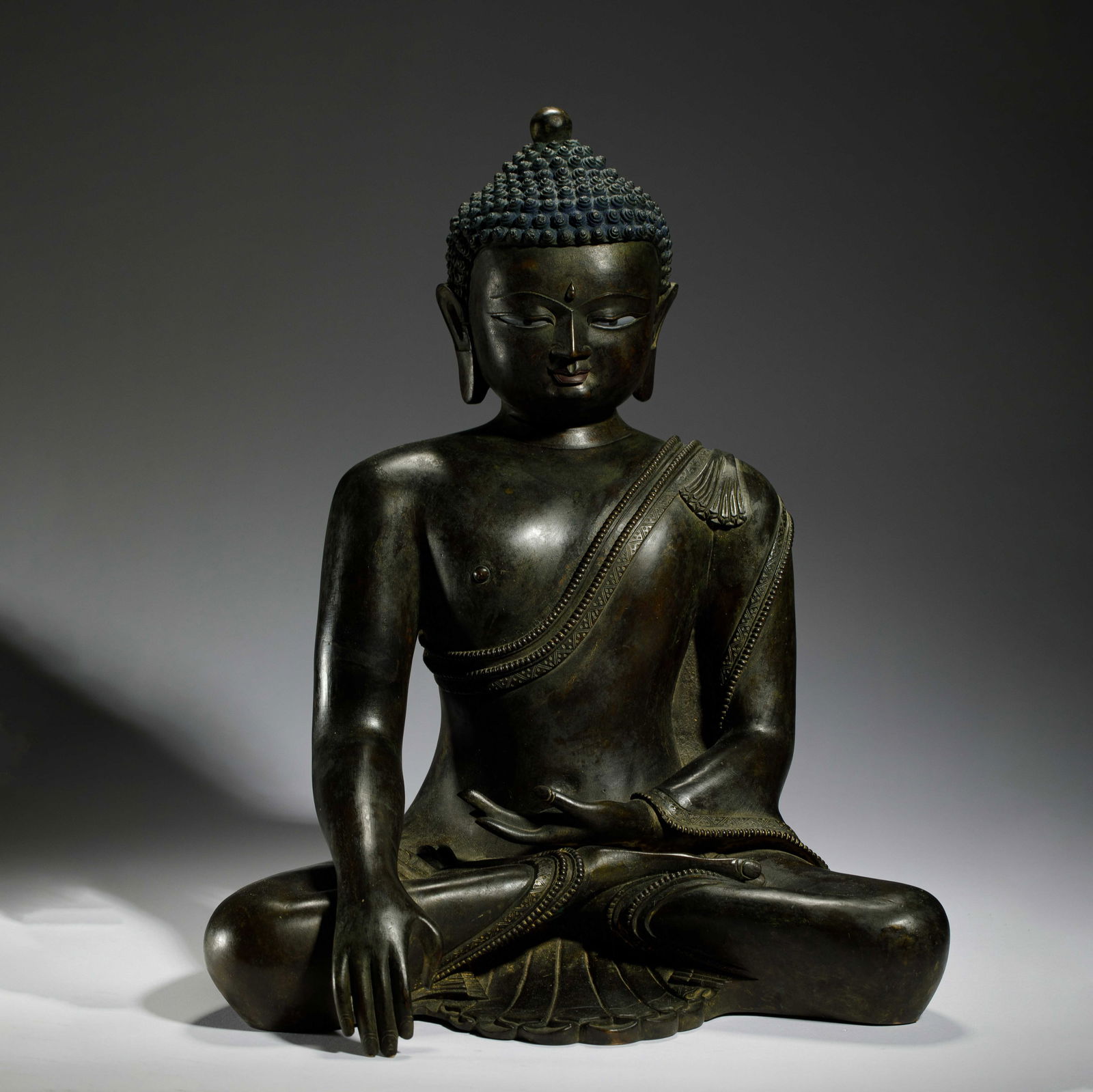 A BRONZE SEATED SHAKYAMUNI (1 of 8)