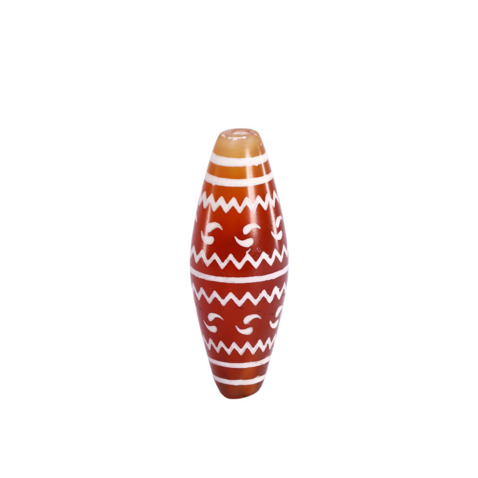 A TIBETAN DZI BEAD: A TIBETAN DZI BEAD This Chinese carnelian dzi bead exhibits a rich, translucent orange-red hue, with a smooth, polished surface that highlights its natural luster. It is decorated with crisp white