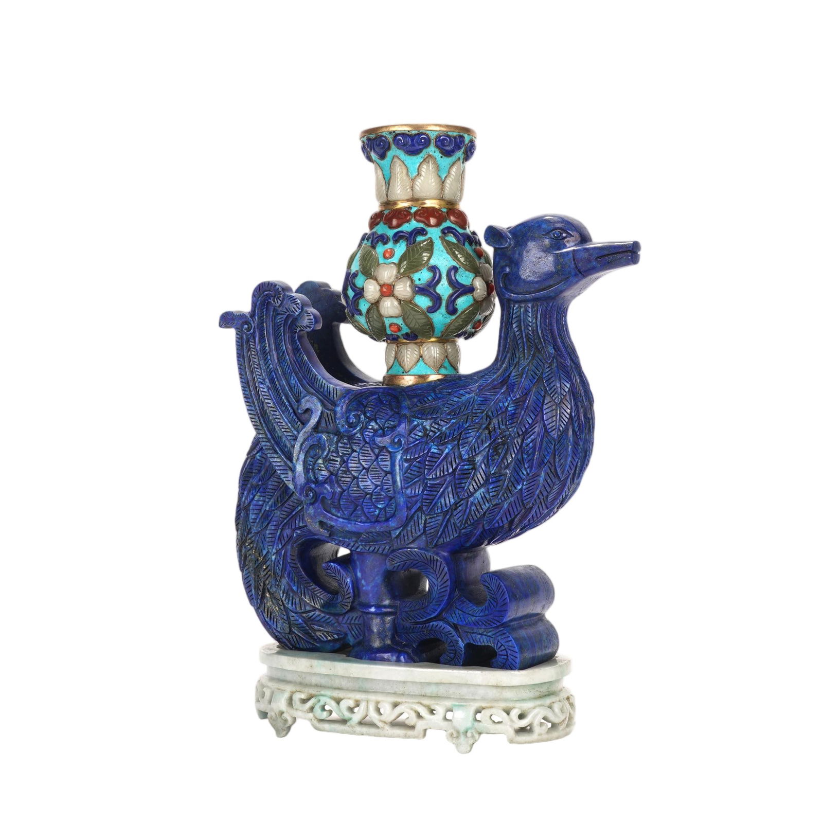 A CARVED LAPIS MYTHICAL BIRD: A CARVED LAPIS MYTHICAL BIRD A magnificent Chinese sculpture, featuring a phoenix masterfully carved from deep, vivid lapis lazuli, its plumage detailed with fine, incised lines to mimic the texture o