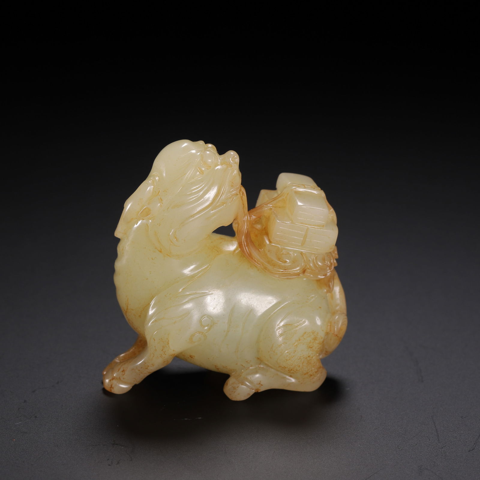 A CARVED WHITE JADE MYTHICAL BEAST (1 of 9)