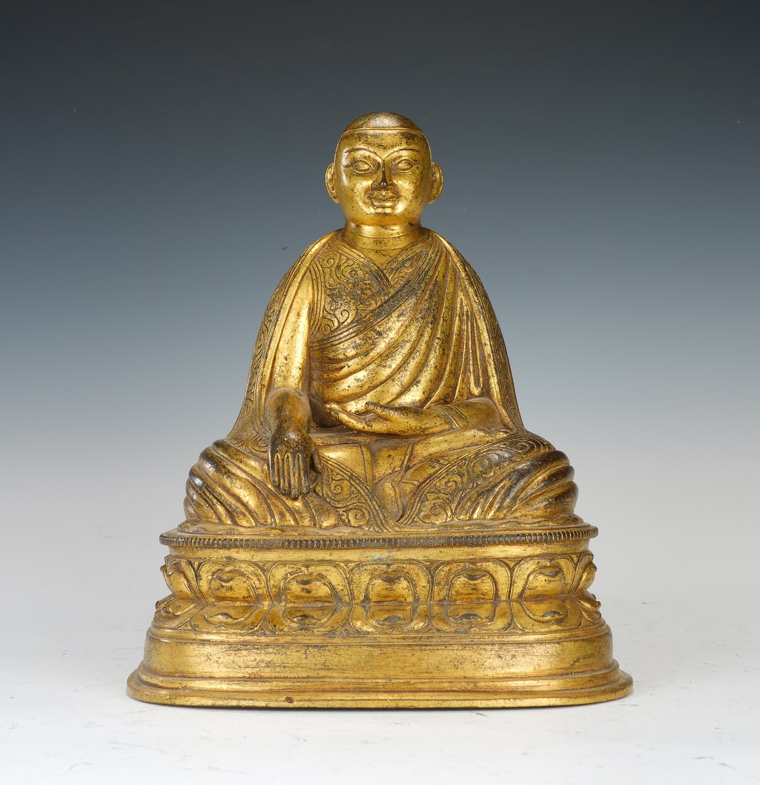 A BRONZE-GILT SEATED LAMA (1 of 9)