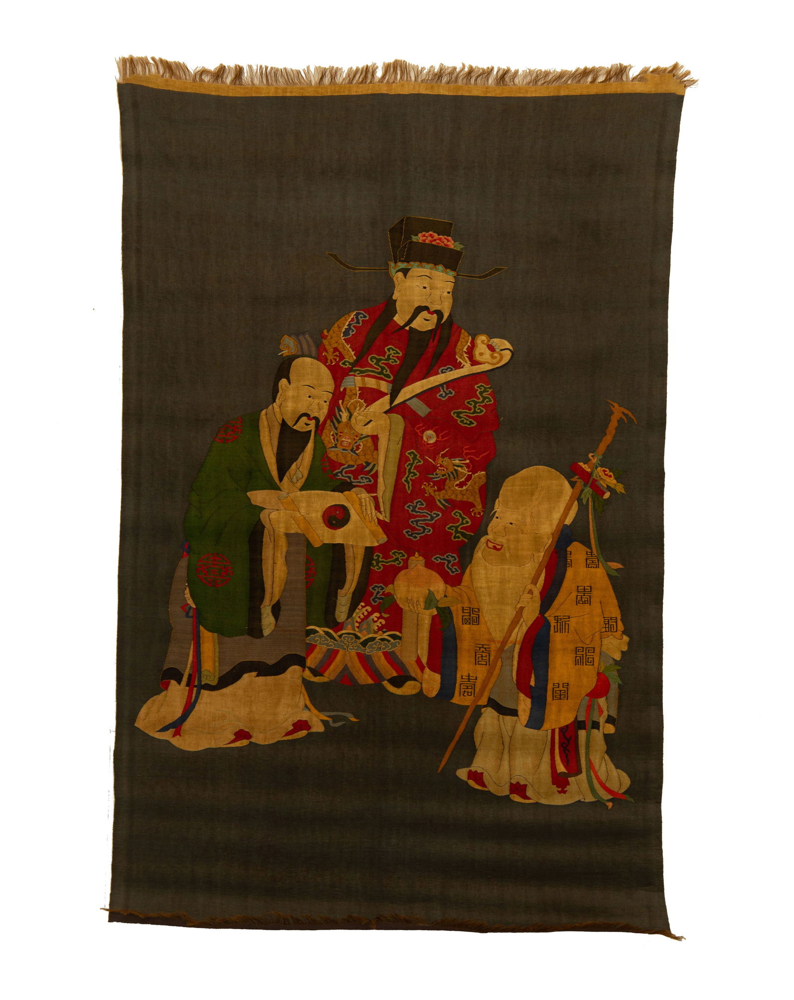 A KESI EMBROIDERED THREE STARS OF GODS HANGING PANEL: A KESI EMBROIDERED THREE STARS OF GODS HANGING PANEL A Chinese kesi tapestry depicting the Three Star Immortals (Fu, Lu, Shou) in celebration of longevity. The figures are rendered in vibrant silk thr