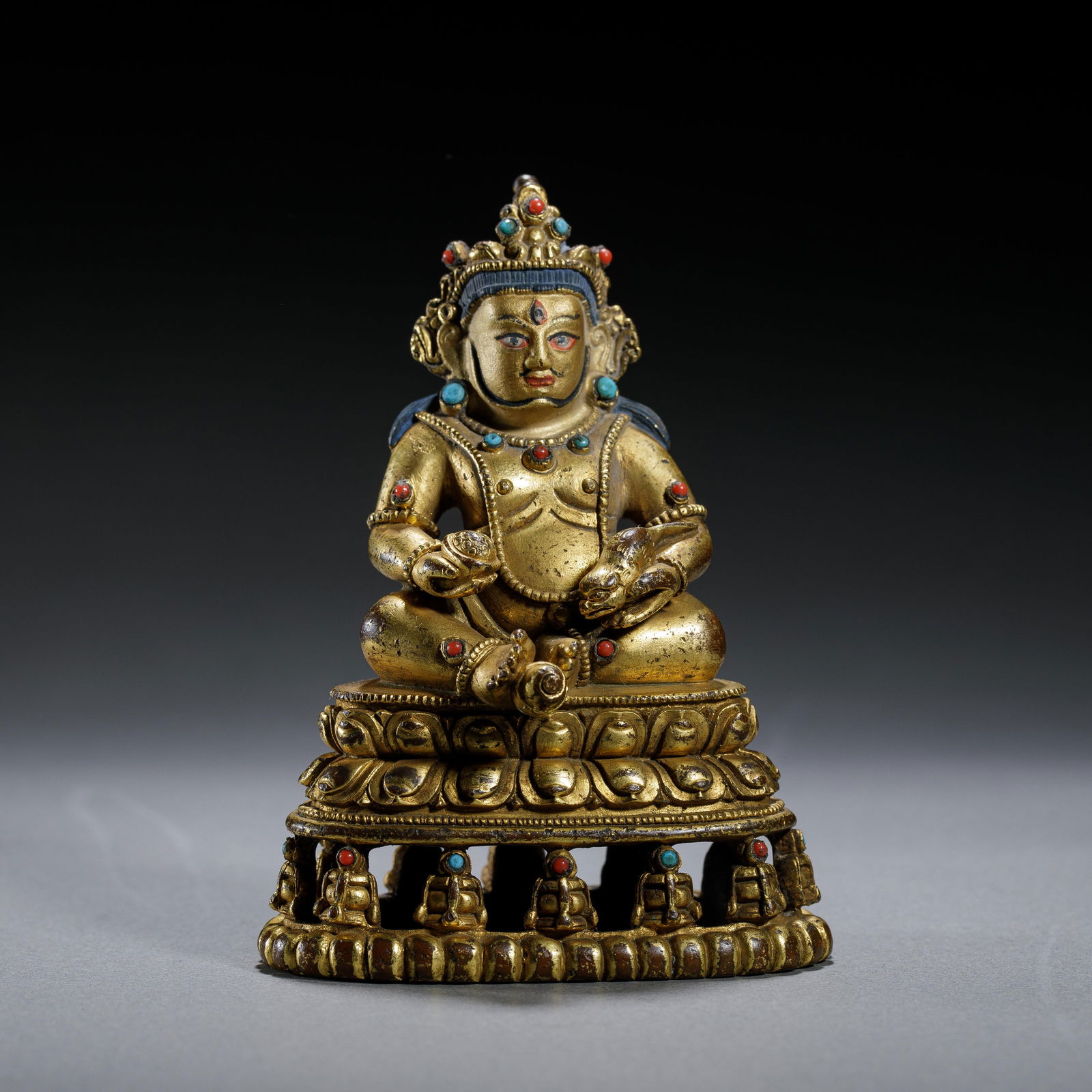 A BRONZE-GILT FIGURE OF JAMBHALA (1 of 5)