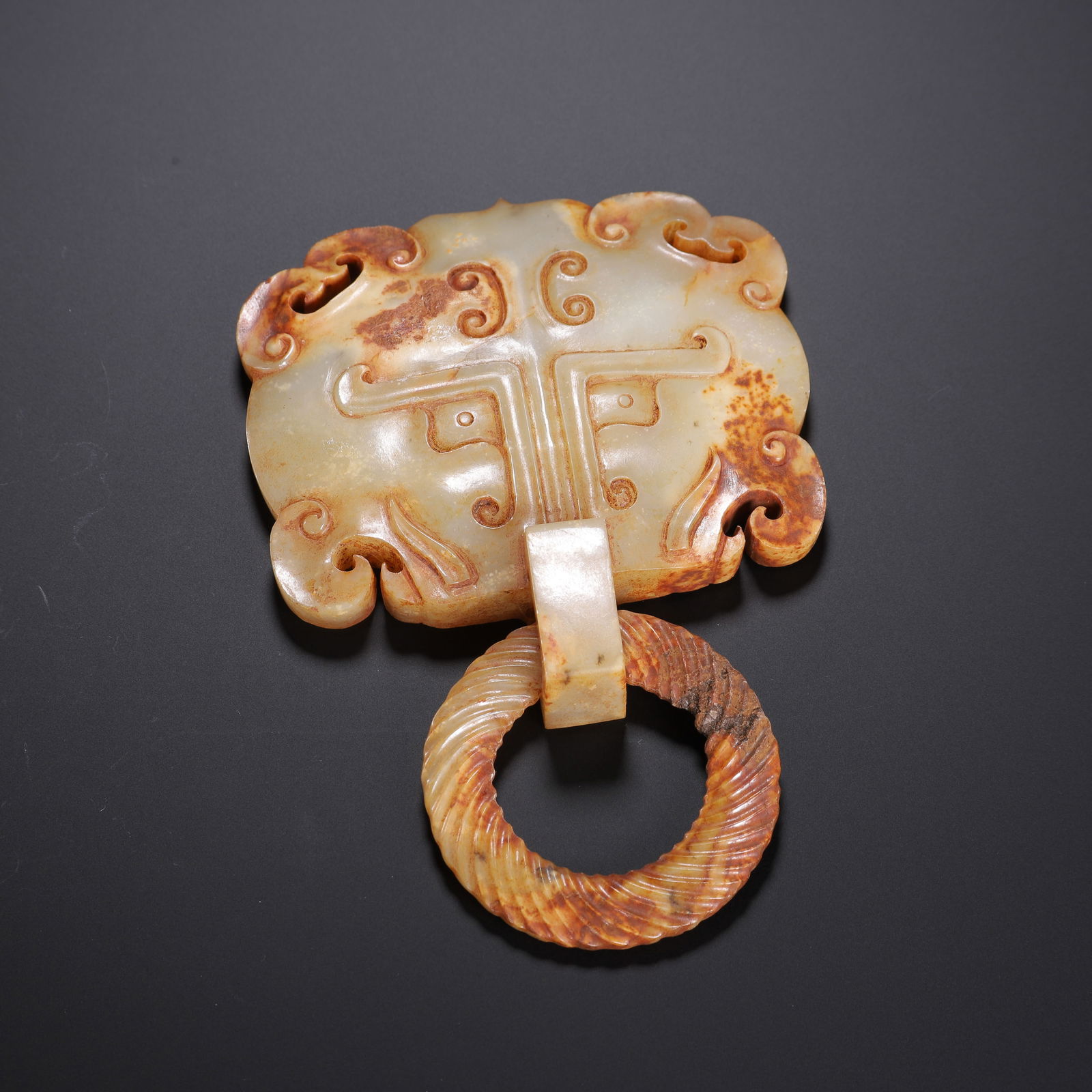 A CARVED JADE MYTHICAL BEAST MASK WITH RING (1 of 9)