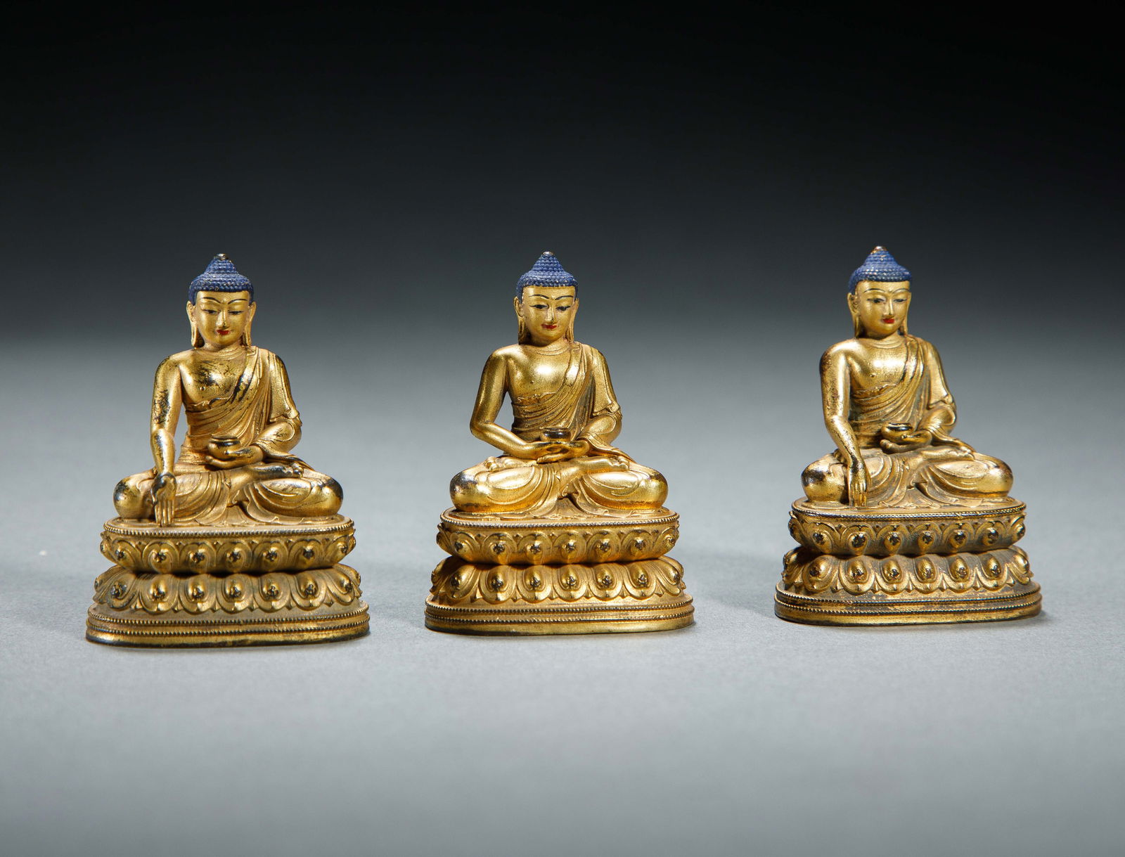 A BRONZE-GILT TRINITY BUDDHAS (1 of 6)