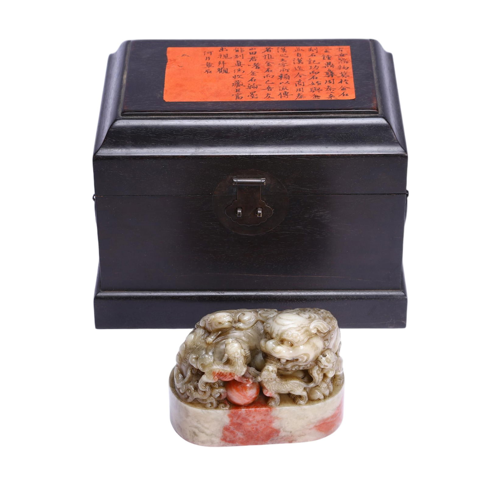 A CARVED TIANHUANG BEAST SEAL: A CARVED TIANHUANG BEAST SEAL This Chinese Shoushan stone seal is masterfully carved from a piece of variegated Shoushan stone, displaying a harmonious blend of pale greyish-white and vibrant red