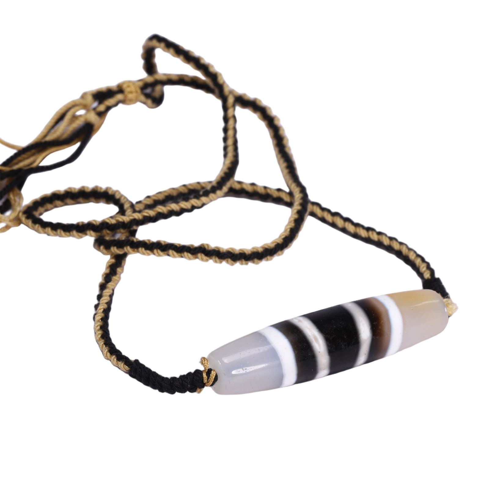 A TIBETAN DZI BEAD PENDANT (1 of 9)