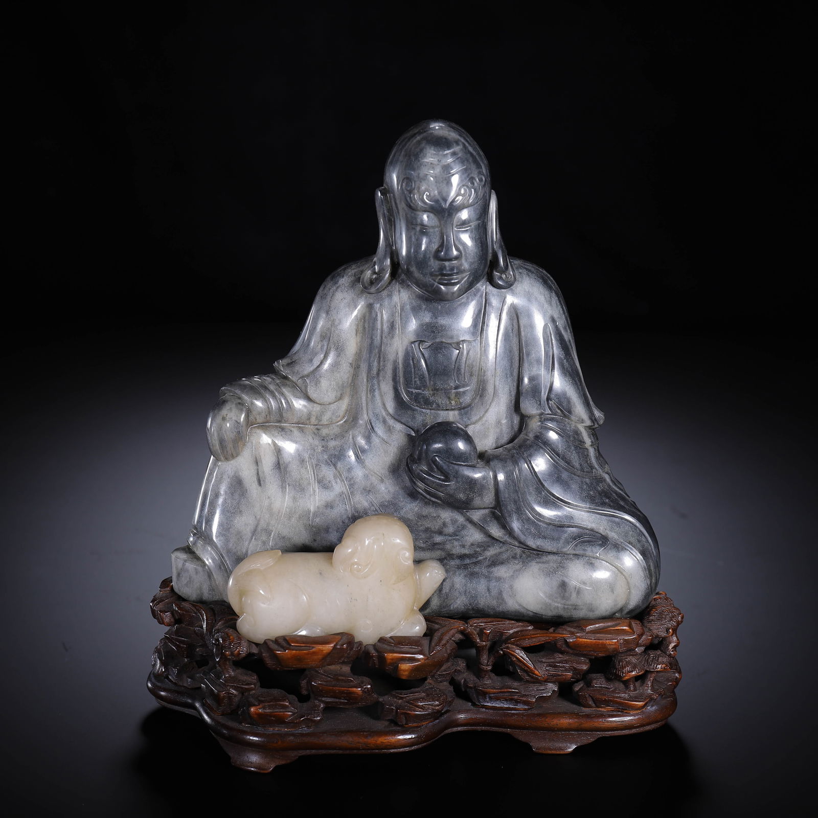 A CARVED JADE SEATED LUOHAN (1 of 9)