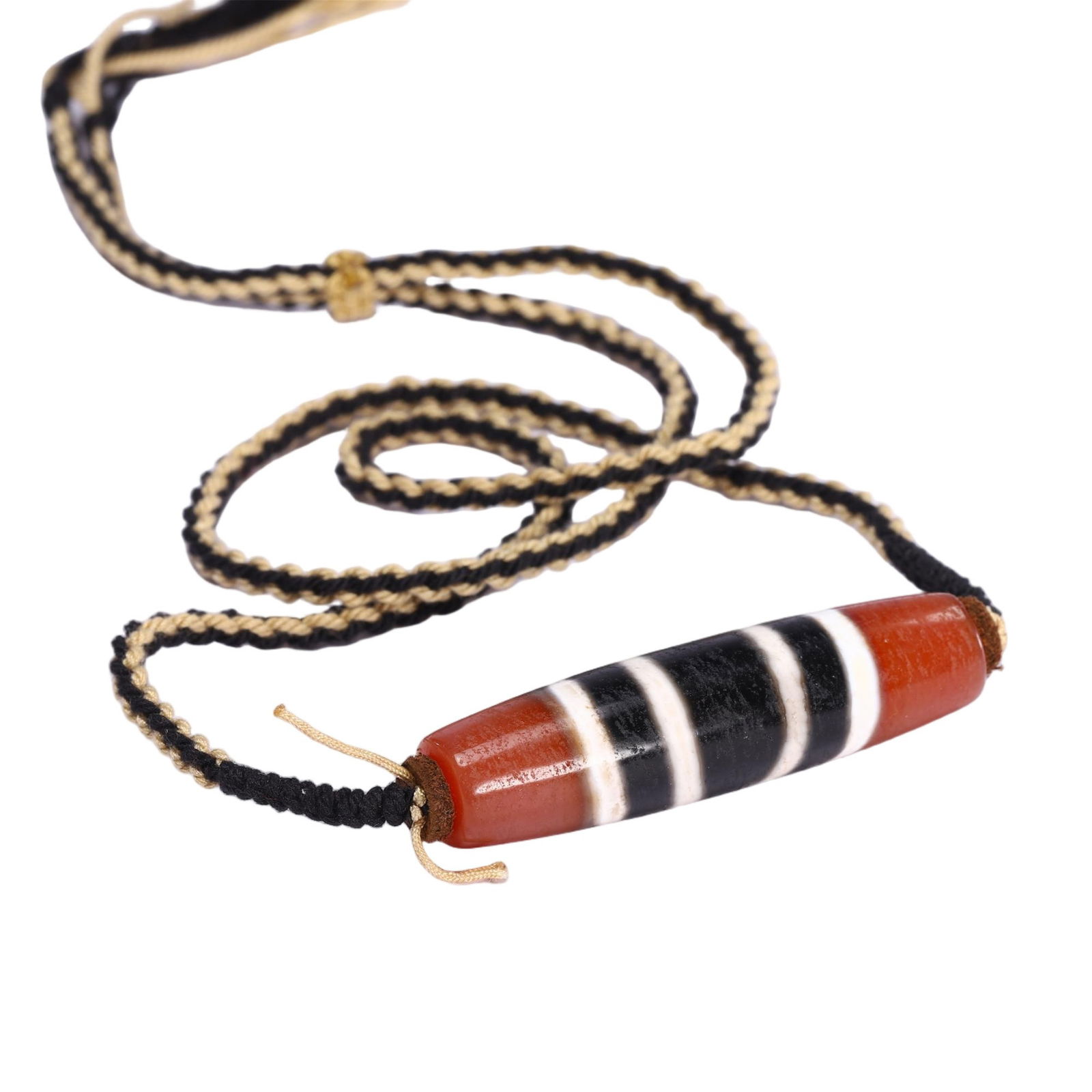 A TIBETAN DZI BEAD PENDANT (1 of 9)