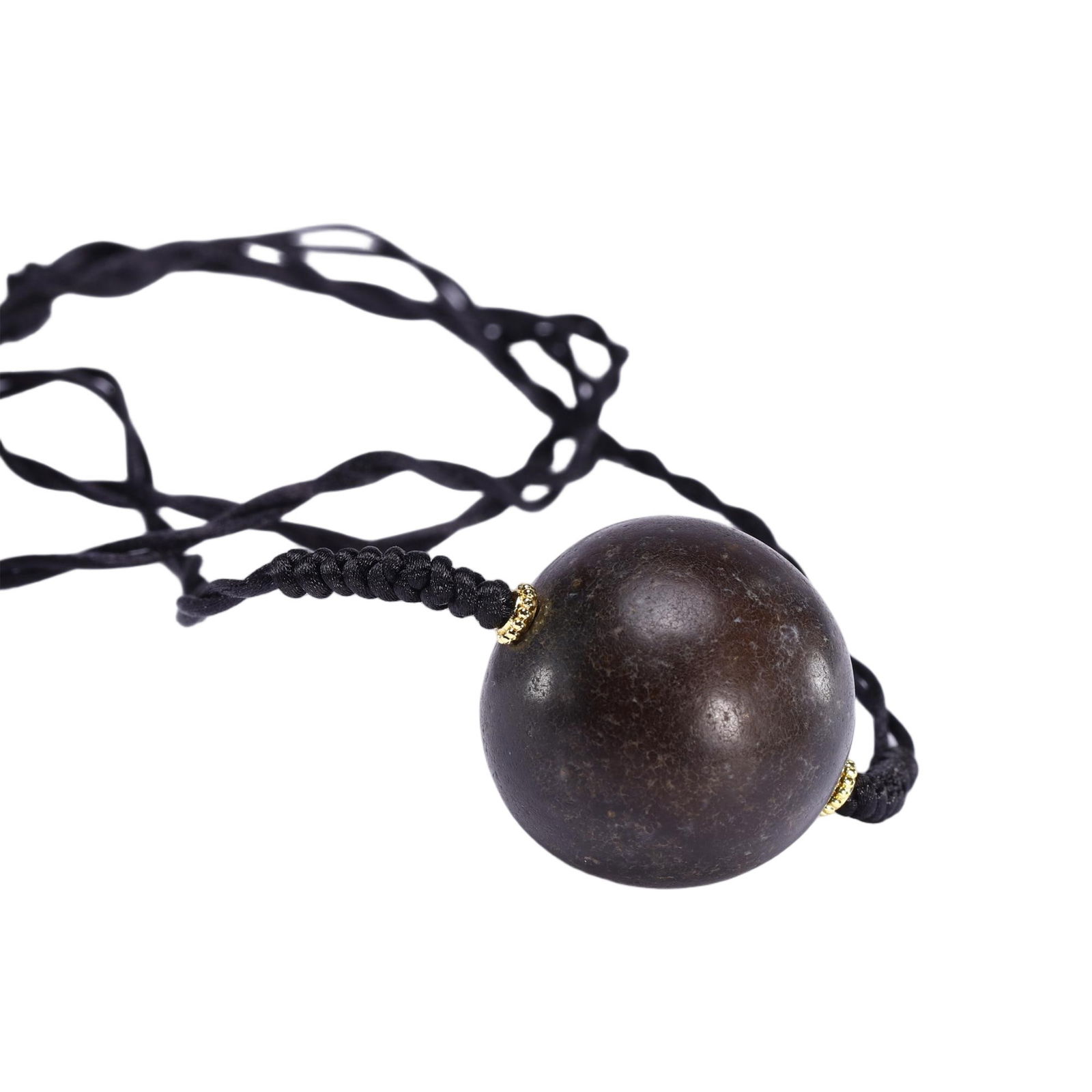 AN AGATE BEAD PENDANT: AN AGATE BEAD PENDANT This Chinese dzi bead pendant necklace features a large, spherical dzi bead of deep, earthy brown hue, suspended from a black cord with delicate gold accents. The bead’s smooth