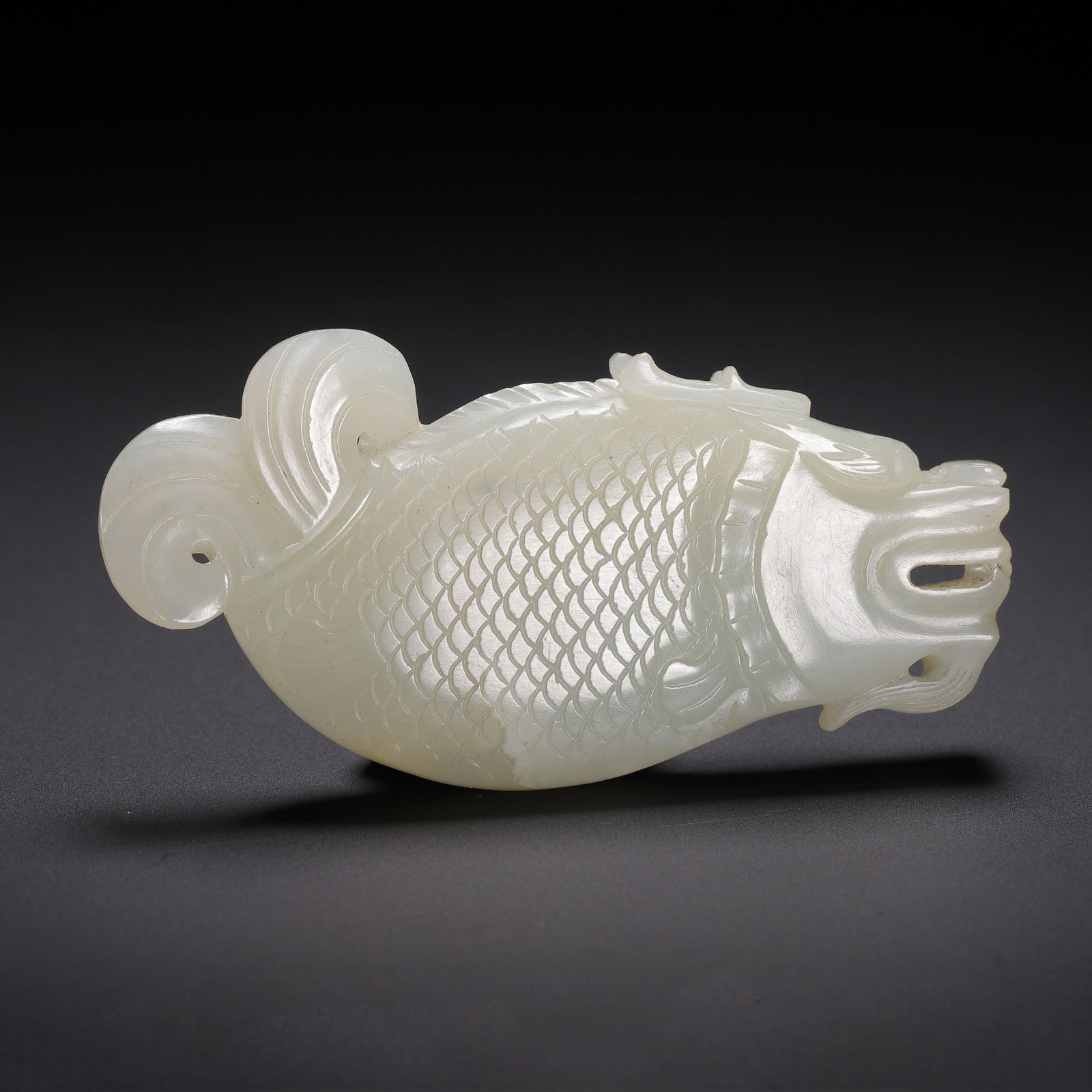 A CARVED WHITE JADE CARP (1 of 9)