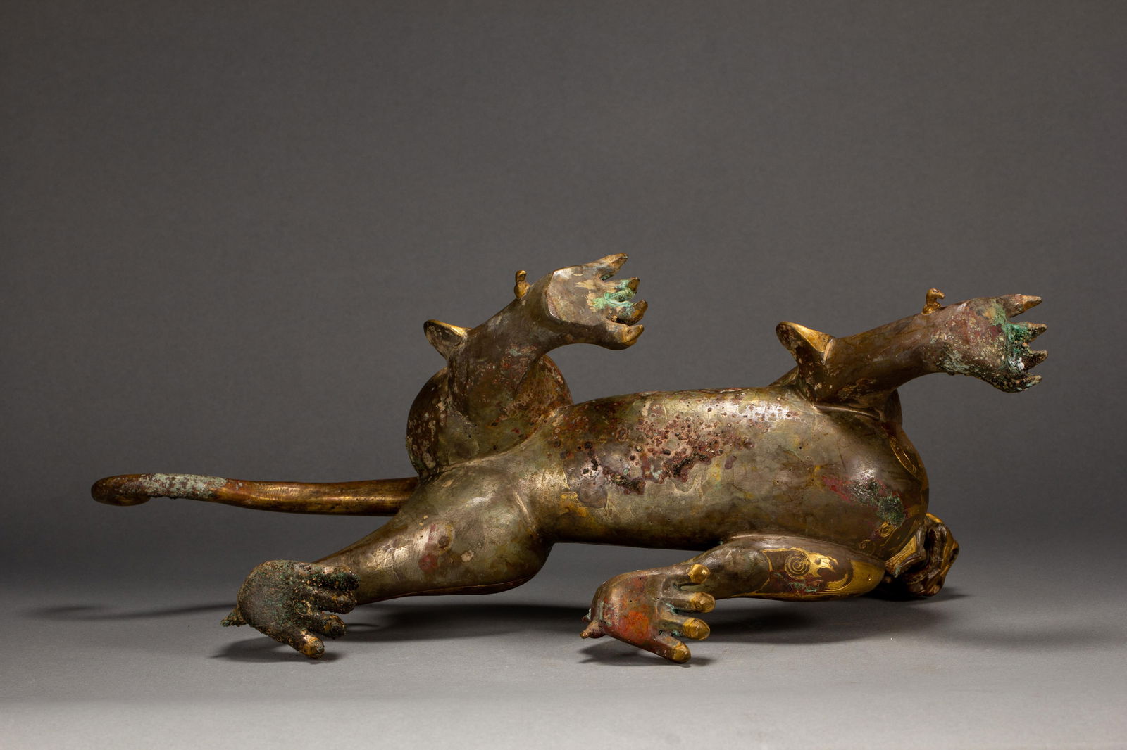 A GOLD AND SILVER INLAID BRONZE MYTHICAL BEAST - 10