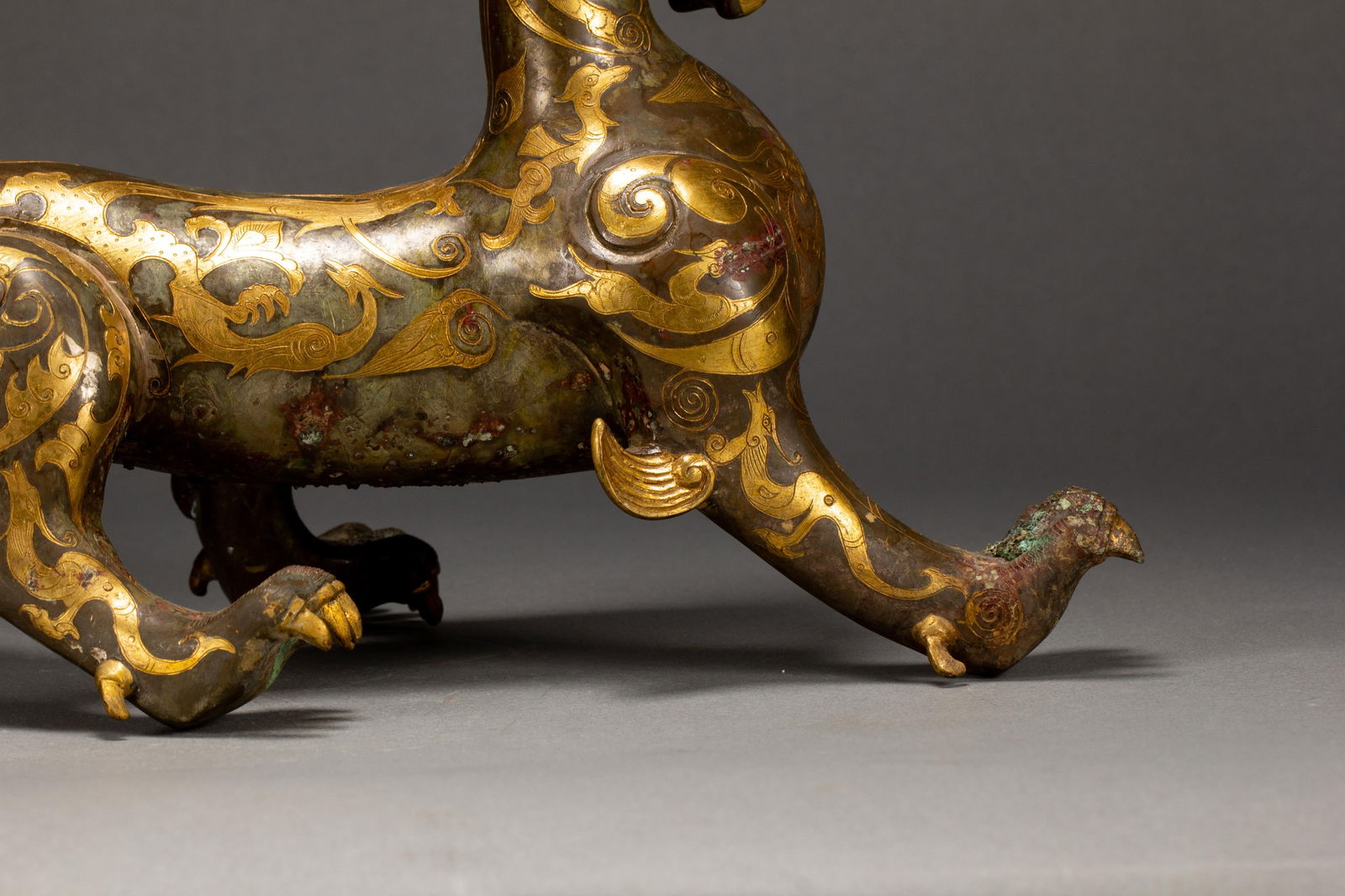 A GOLD AND SILVER INLAID BRONZE MYTHICAL BEAST - 9