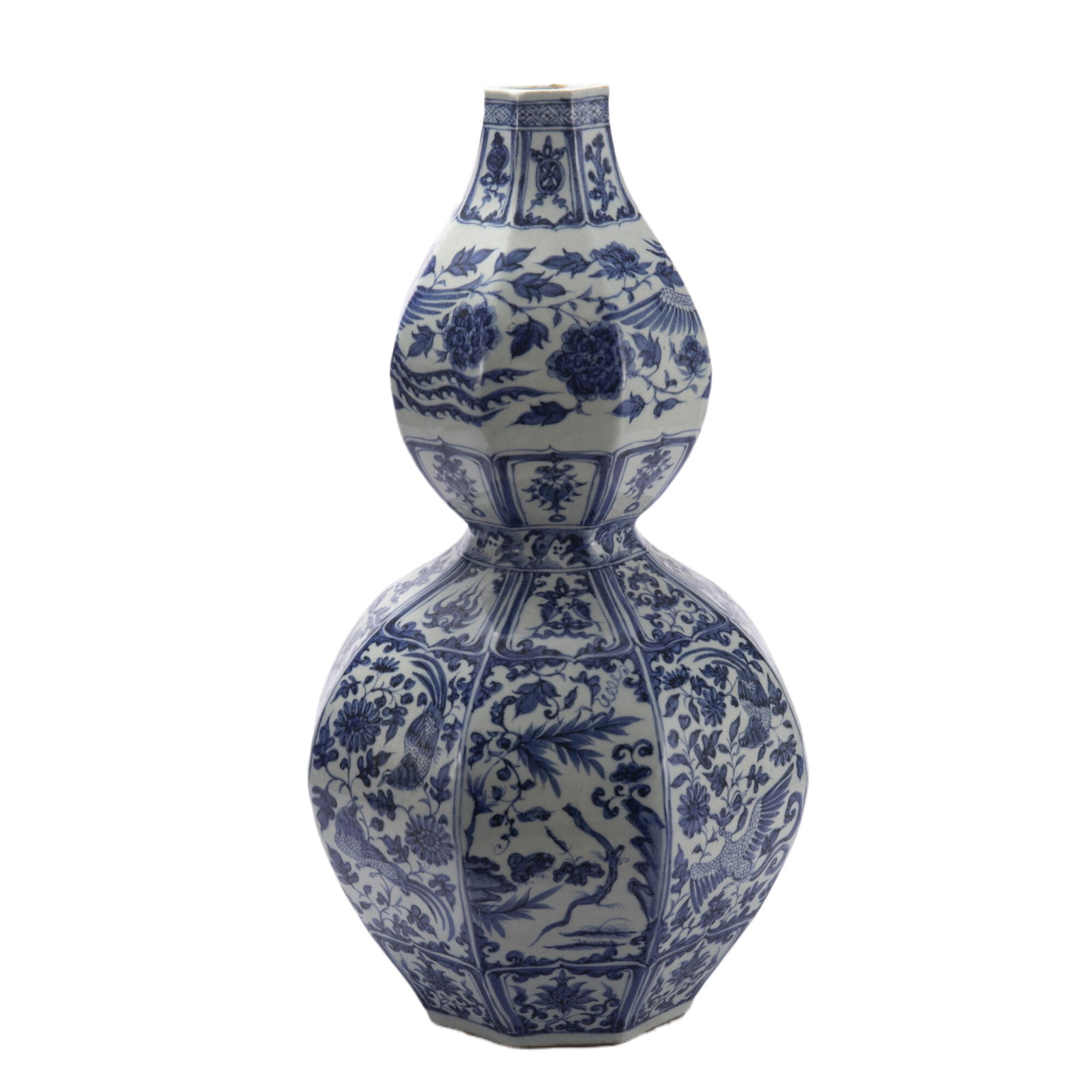 A CHINESE BLUE AND WHITE DOUBLE-GOURD VASE: A CHINESE BLUE AND WHITE DOUBLE-GOURD VASE This Chinese blue and white double-gourd vase is a striking octagonal form, with a slender upper bulb and a broad lower bulb, covered in a bright white glaze