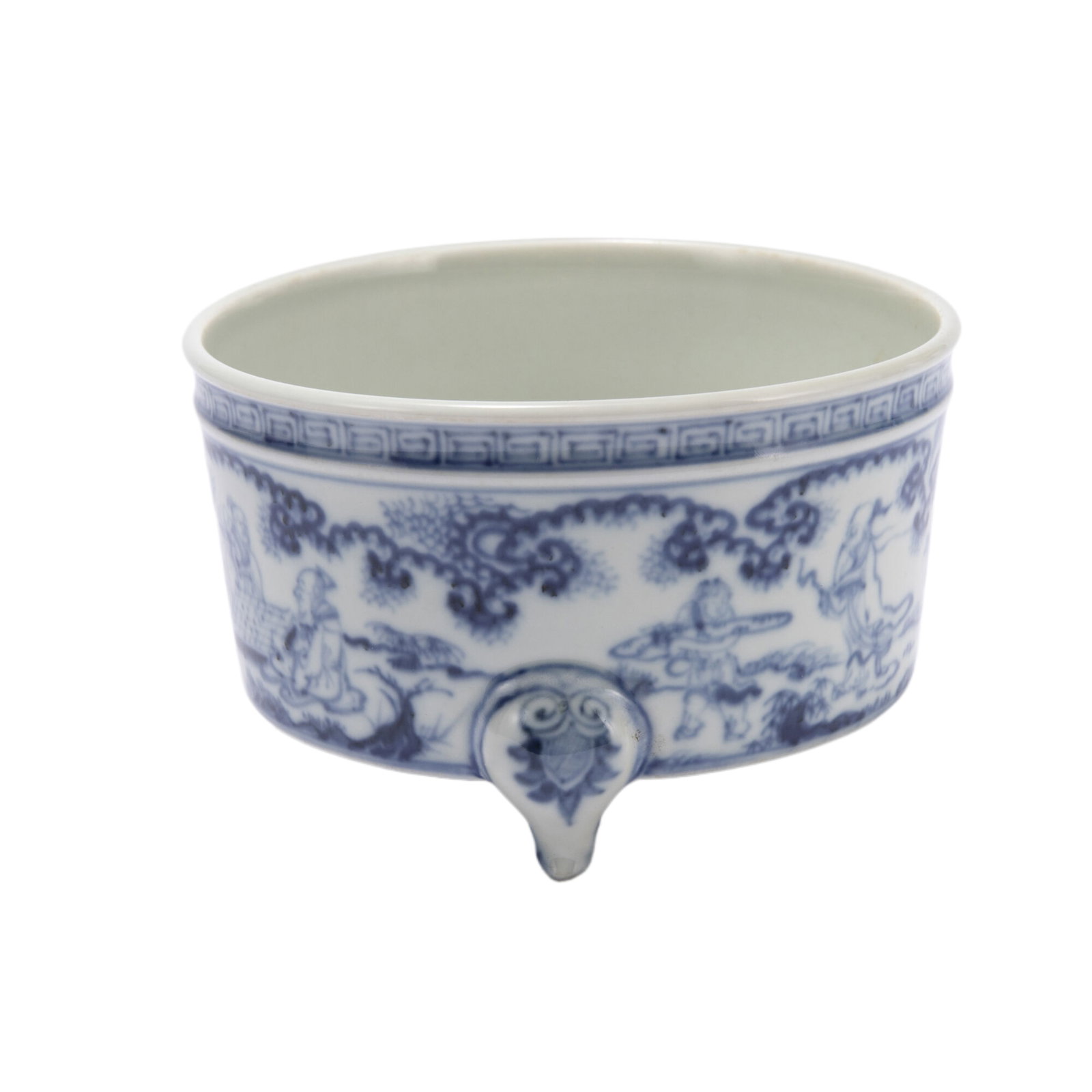 A BLUE AND WHITE PORCELAIN TRIPOT CENSER: A BLUE AND WHITE PORCELAIN TRIPOT CENSER It is covered overall with a thick pale sky blue glaze with a continuous scene of figural story, raised from tripod supports, under key fret band. DIMENSIONS: 